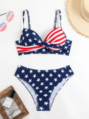 A two-piece bikini with a national flag theme, featuring an Independence Day celebration. The top has a twisted, gathered design, while the bottom is a high-waisted triangle style with thin straps. Perfect for vacation pool a