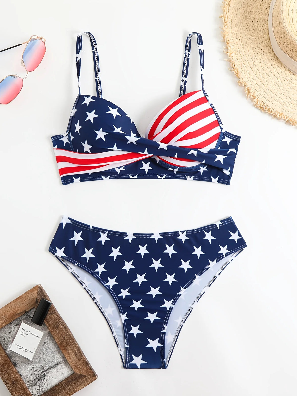 A two-piece bikini with a national flag theme, featuring an Independence Day celebration. The top has a twisted, gathered design, while the bottom is a high-waisted triangle style with thin straps. Perfect for vacation pool a
